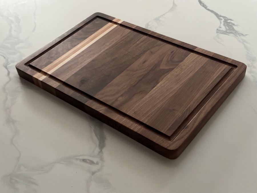 Walnut cutting board, angled on marble